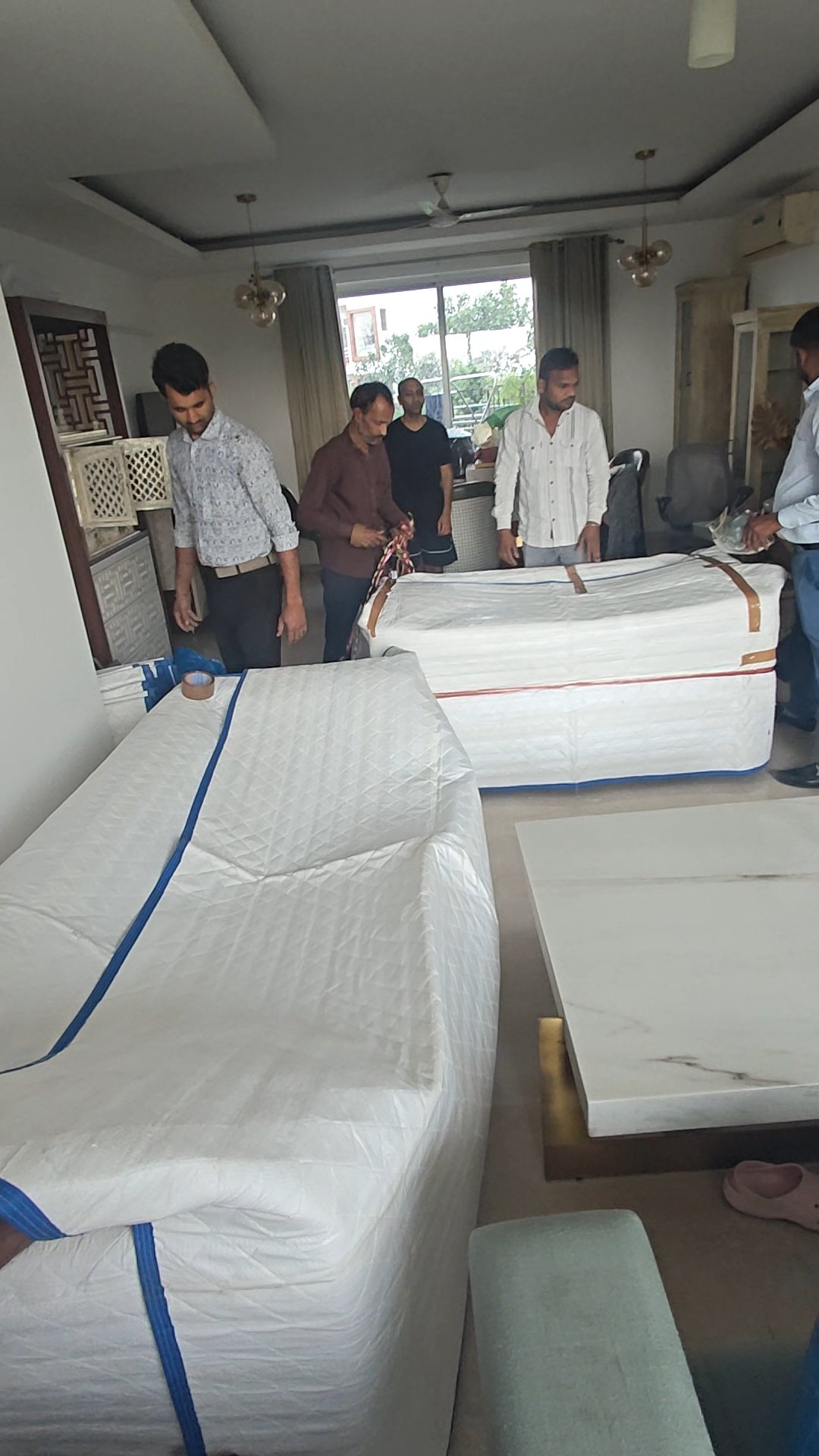 Prince Packers Movers team professionally packing household items in Delhi